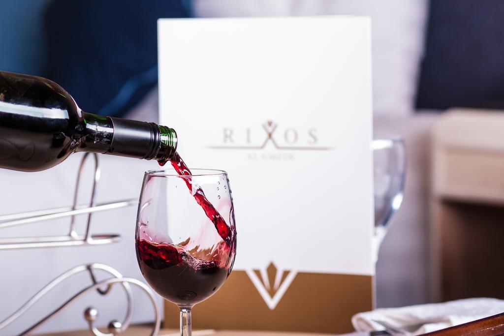 Rixos Alamein - Full Board Plus El Alamein Ngoại thất bức ảnh Wine being poured into a wine glass