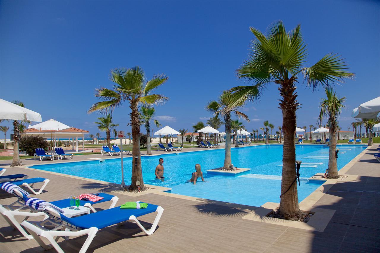 Rixos Alamein - Full Board Plus El Alamein Ngoại thất bức ảnh A swimming pool in a hotel